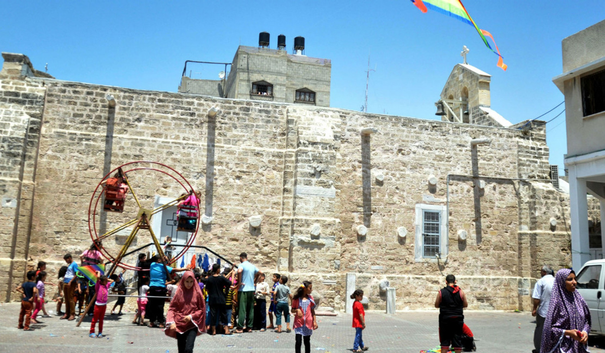 Palestinian Muslims sheltering inside Gaza Church during 2014 offensive celebrating Eid